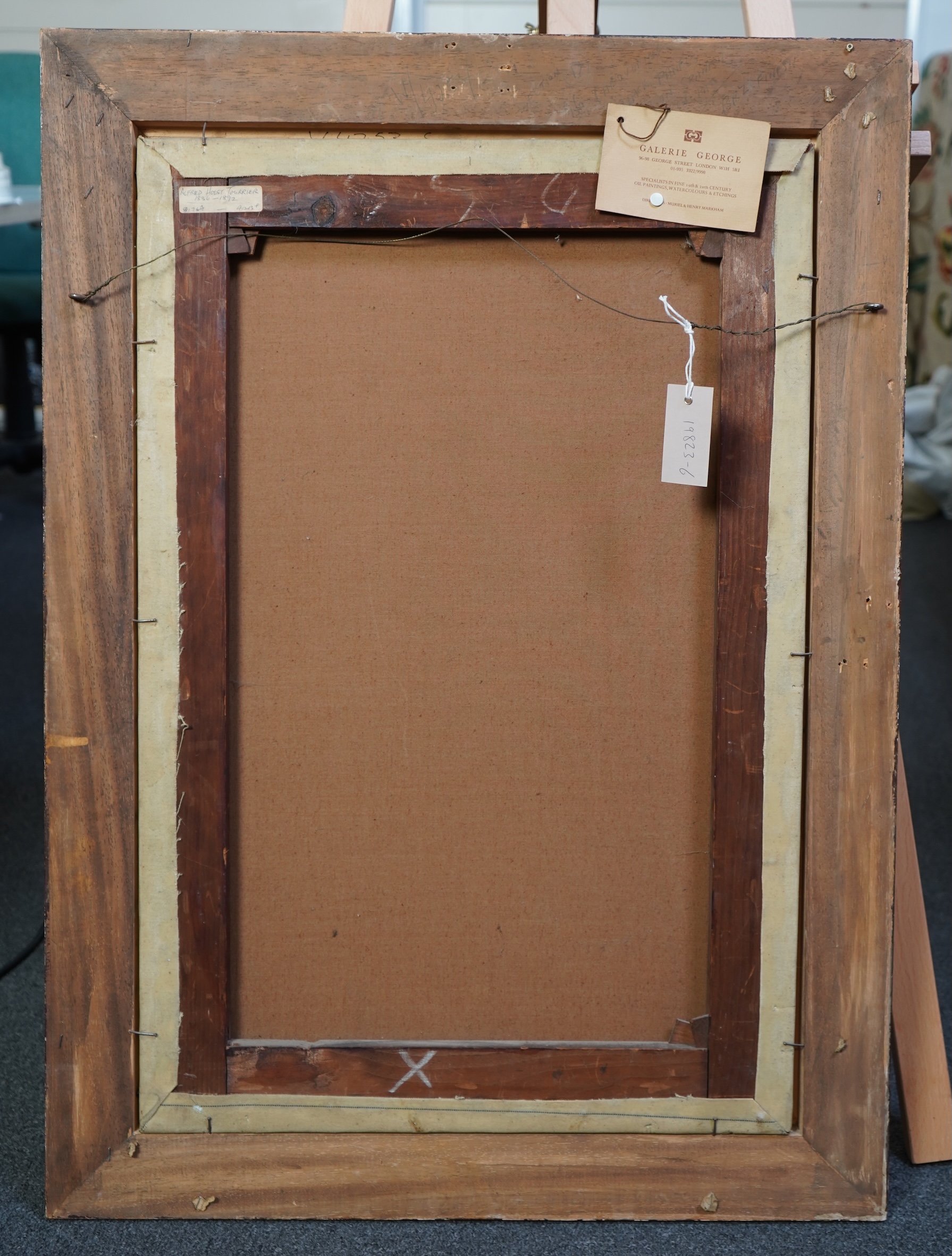 Alfred Holst Tourrier, British 1836-1892, A gentleman wearing Tudor dress seated before an arched window